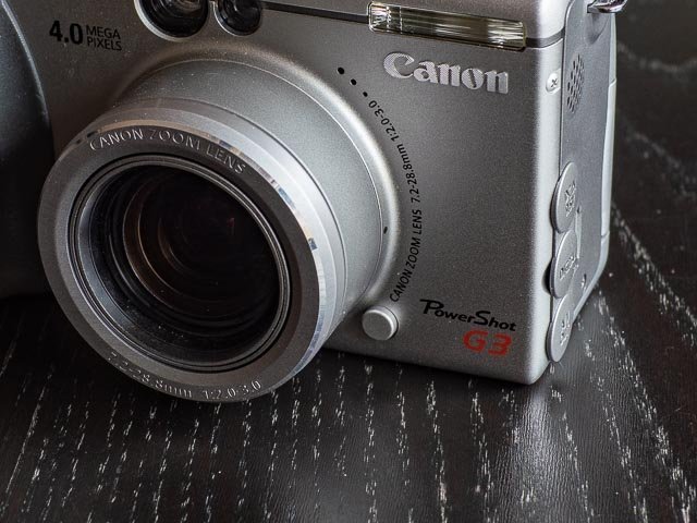 Canon Powershot G3 lens ring release button.