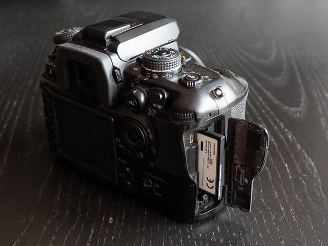Konica Minolta Alpha-7 memory card door on right of camera.