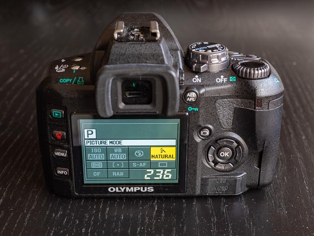 Olympus E-410 rear with quick menu displayed.