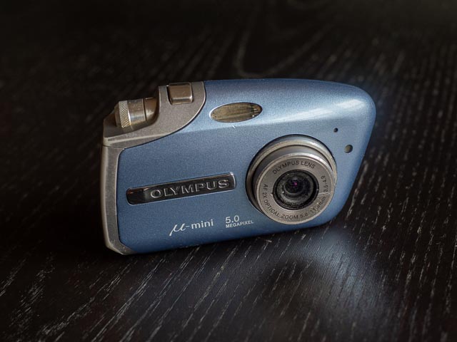 Olympus Mju Mini Digital S in blue, front and switched on