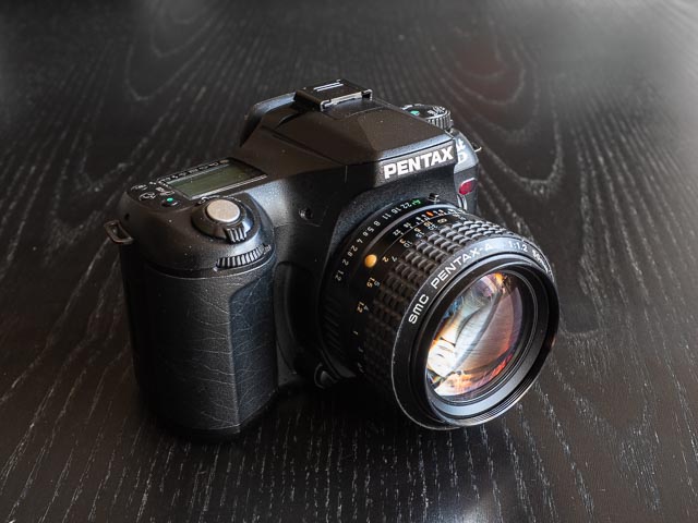 Pentax *ist D fitten with an SMC Pentax-A 50mm f/1.2 lens from 1987.