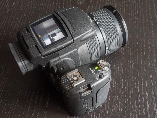 Sony R1 with the LCD monitor positioned for use as a wist-level viewfinder.